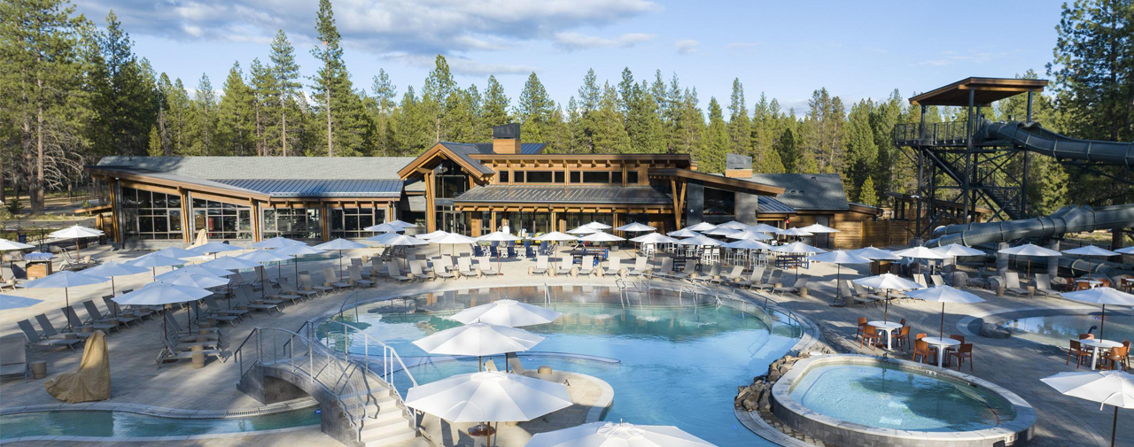Forest House aquatic complex — pools, waterslides, and pines